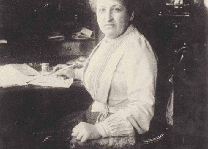 Aletta H. Jacobs behind her desk, 1904.