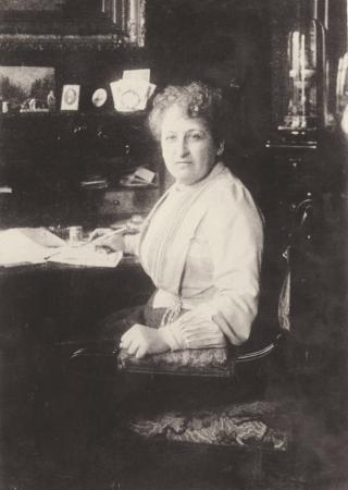 Aletta H. Jacobs behind her desk, 1904.